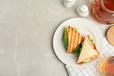 Photo of Delicious sandwiches with vegetables and cheese on light grey table, flat lay. Space or text