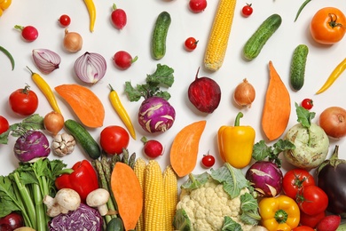 Flat lay composition with fresh vegetables on white background