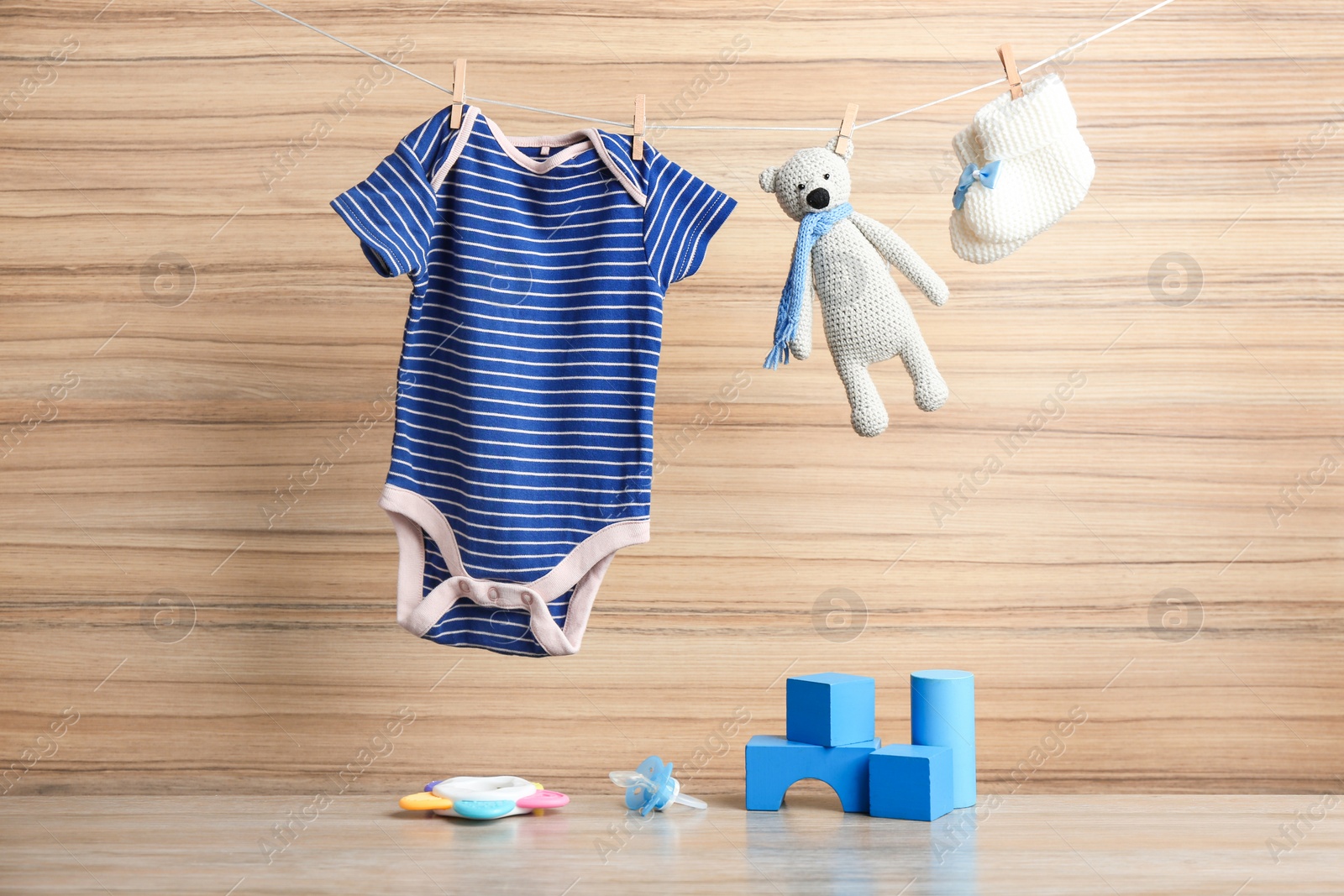 Photo of Composition with baby accessories on wooden background