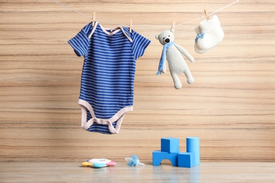 Photo of Composition with baby accessories on wooden background