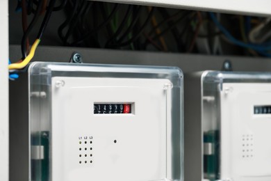 Electric meters and wires in fuse box, closeup