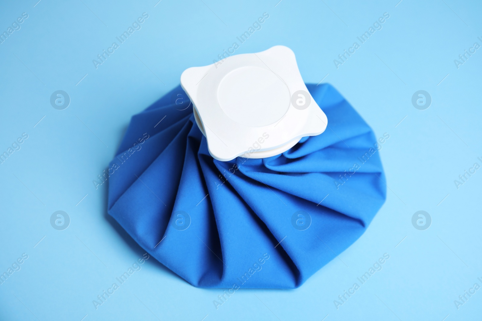 Photo of Ice pack on blue background. Cold compress