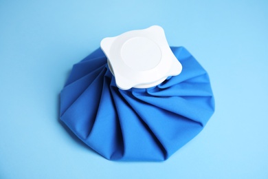 Ice pack on blue background. Cold compress