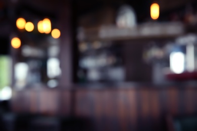 Blurred view of beer pub with wooden counter