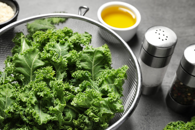 Raw cabbage leaves on table, closeup. Preparing kale chips