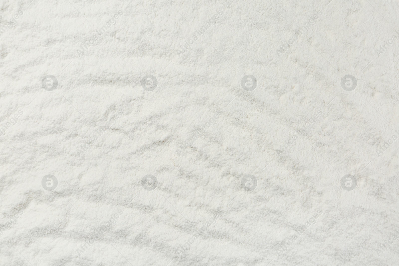 Photo of Pile of organic flour as background, top view