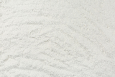 Photo of Pile of organic flour as background, top view