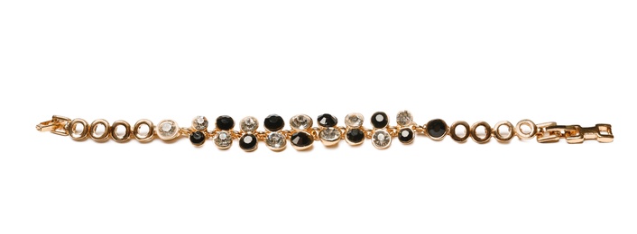 Photo of Stylish bracelet with gemstones isolated on white. Luxury jewelry