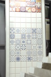 Samples of tile with different patterns on display in store