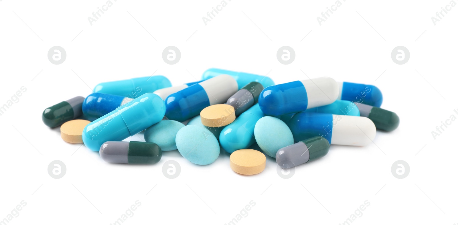 Photo of Heap of different colorful pills isolated on white