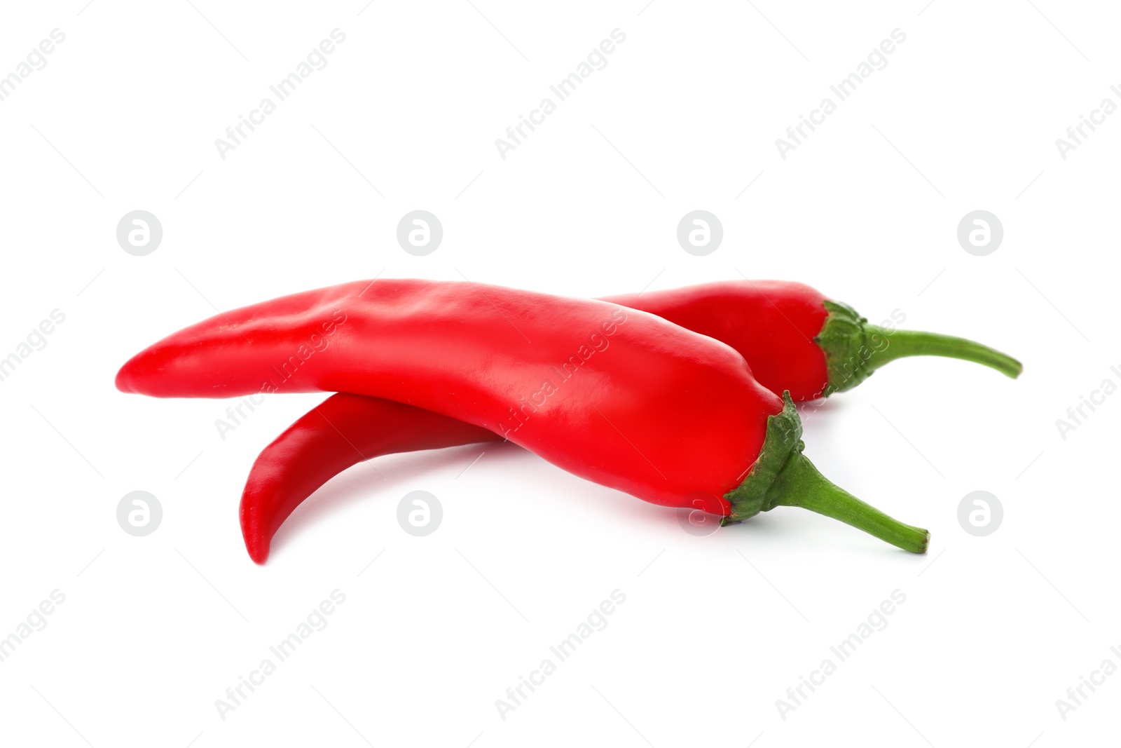 Photo of Red hot chili peppers on white background