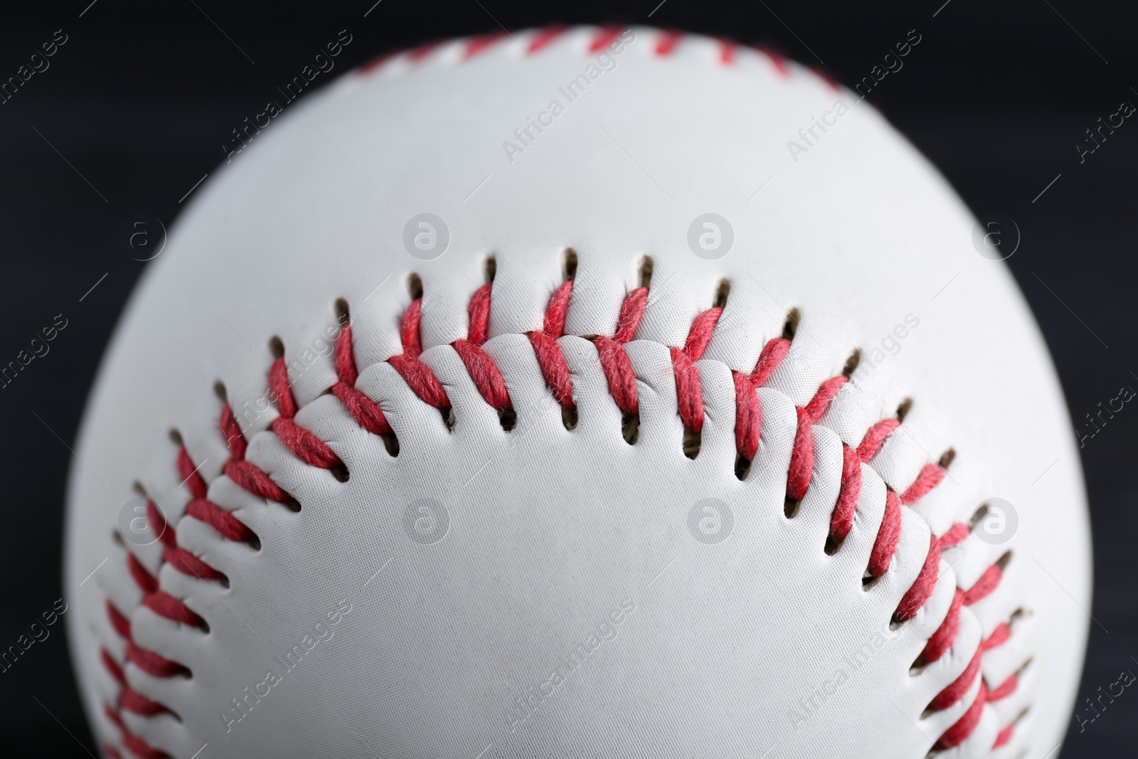 Photo of Baseball ball on black background, closeup. Sports game