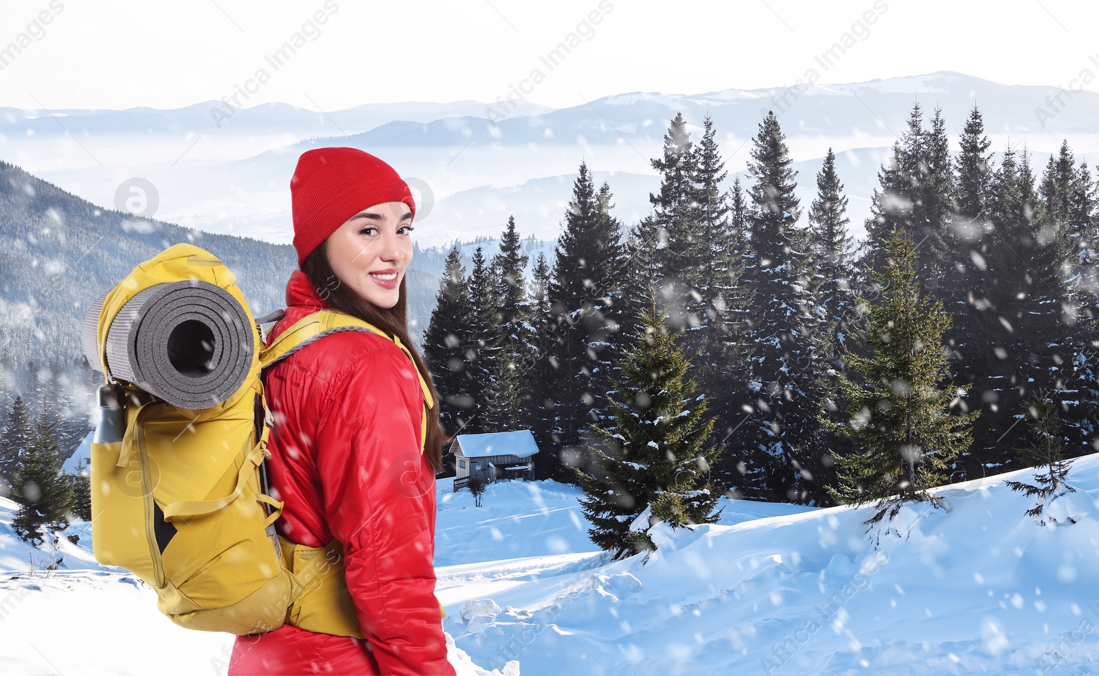 Image of Happy tourist with backpack in snowy mountains