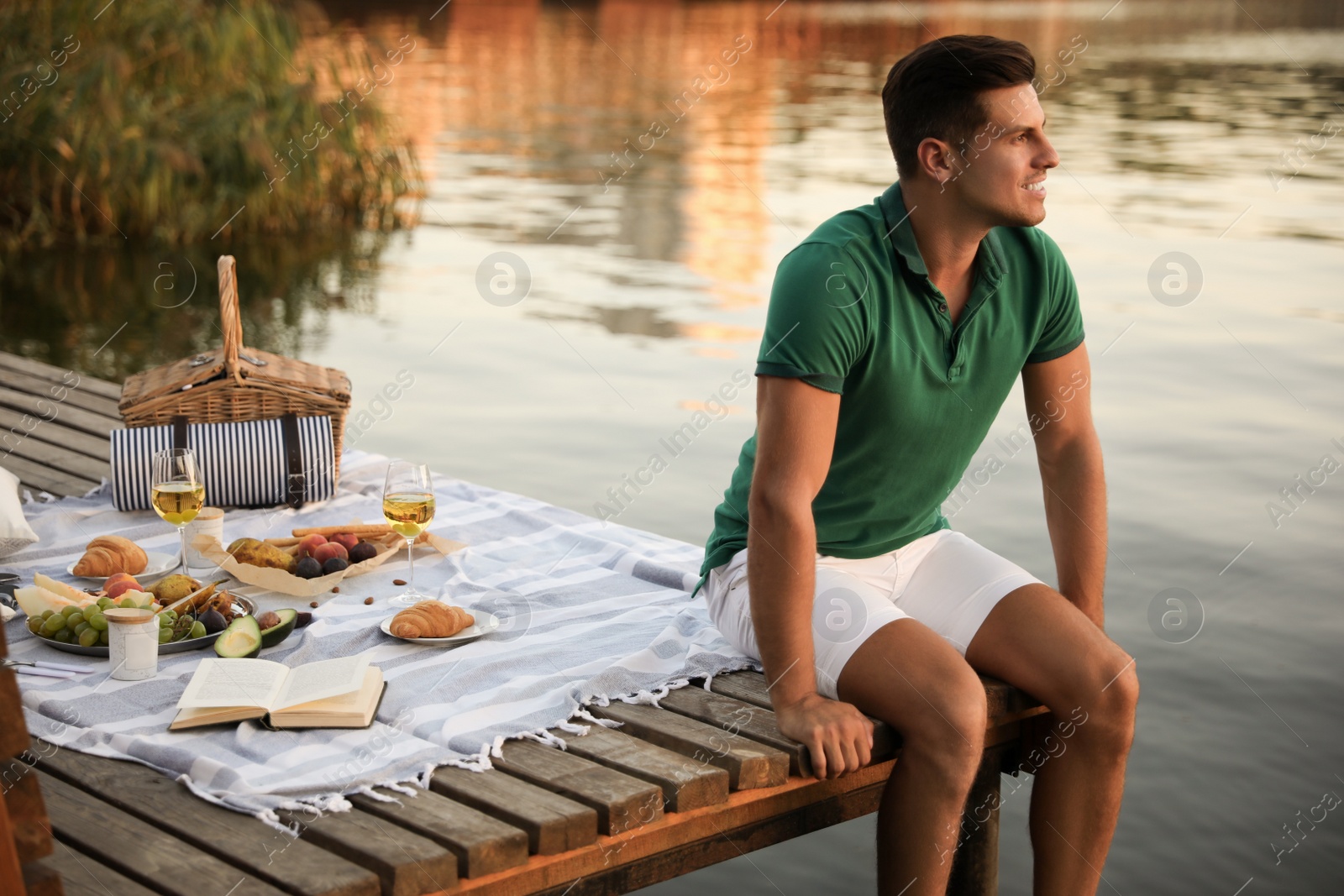 Photo of Man spending time on pier at picnic