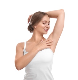Photo of Young woman with smooth clean armpit on white background. Using deodorant