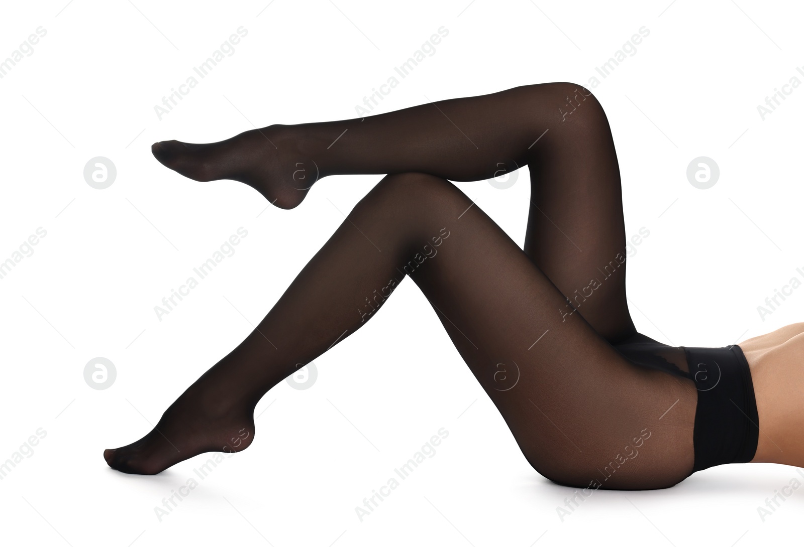 Photo of Woman with beautiful long legs wearing black tights on white background, closeup