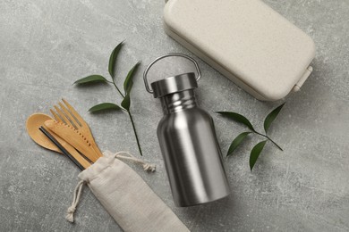 Photo of Flat lay composition with eco friendly products on grey background. Conscious consumption