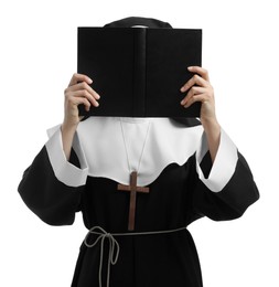 Nun holding open Bible on white background