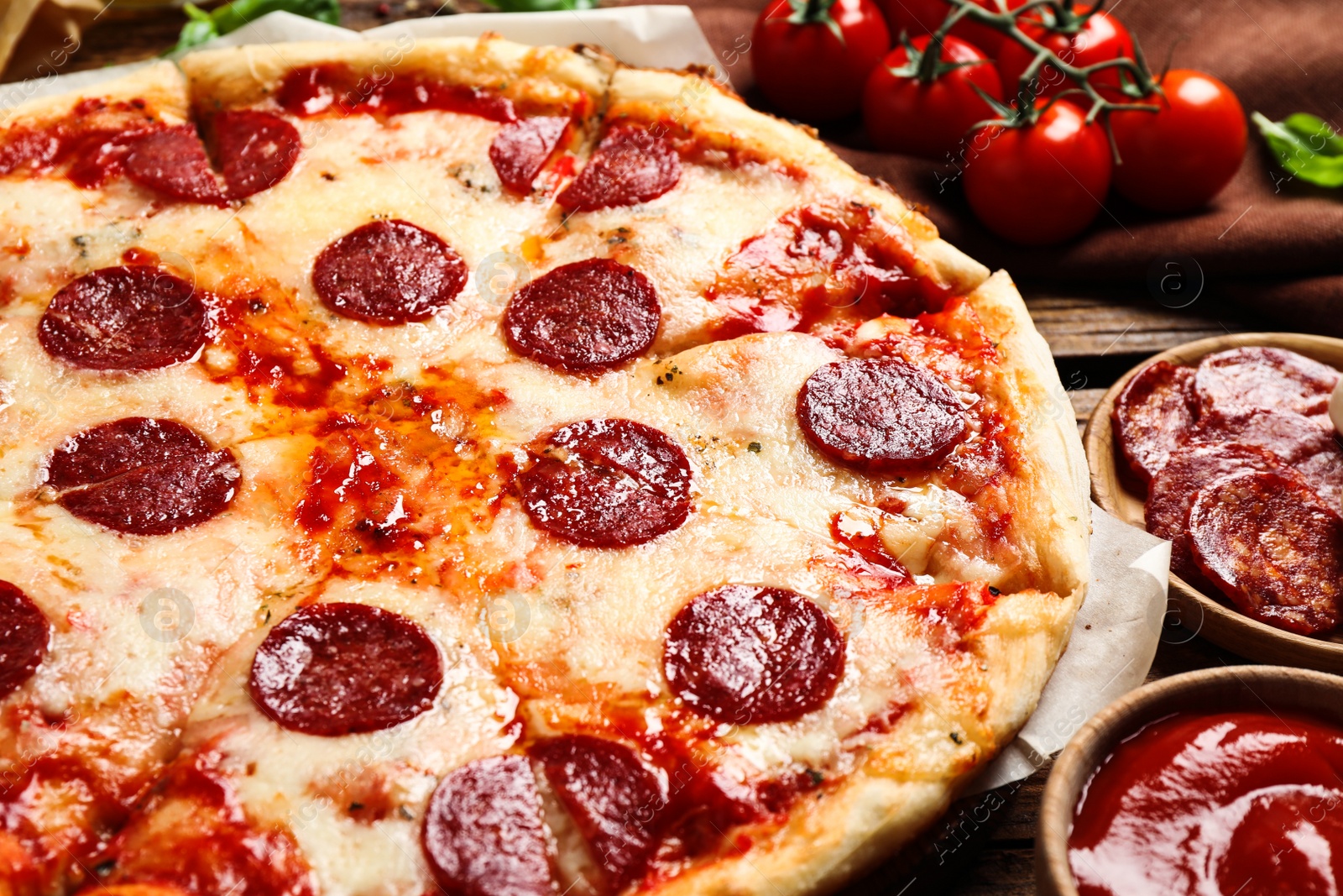 Photo of Hot delicious pepperoni pizza on table, closeup