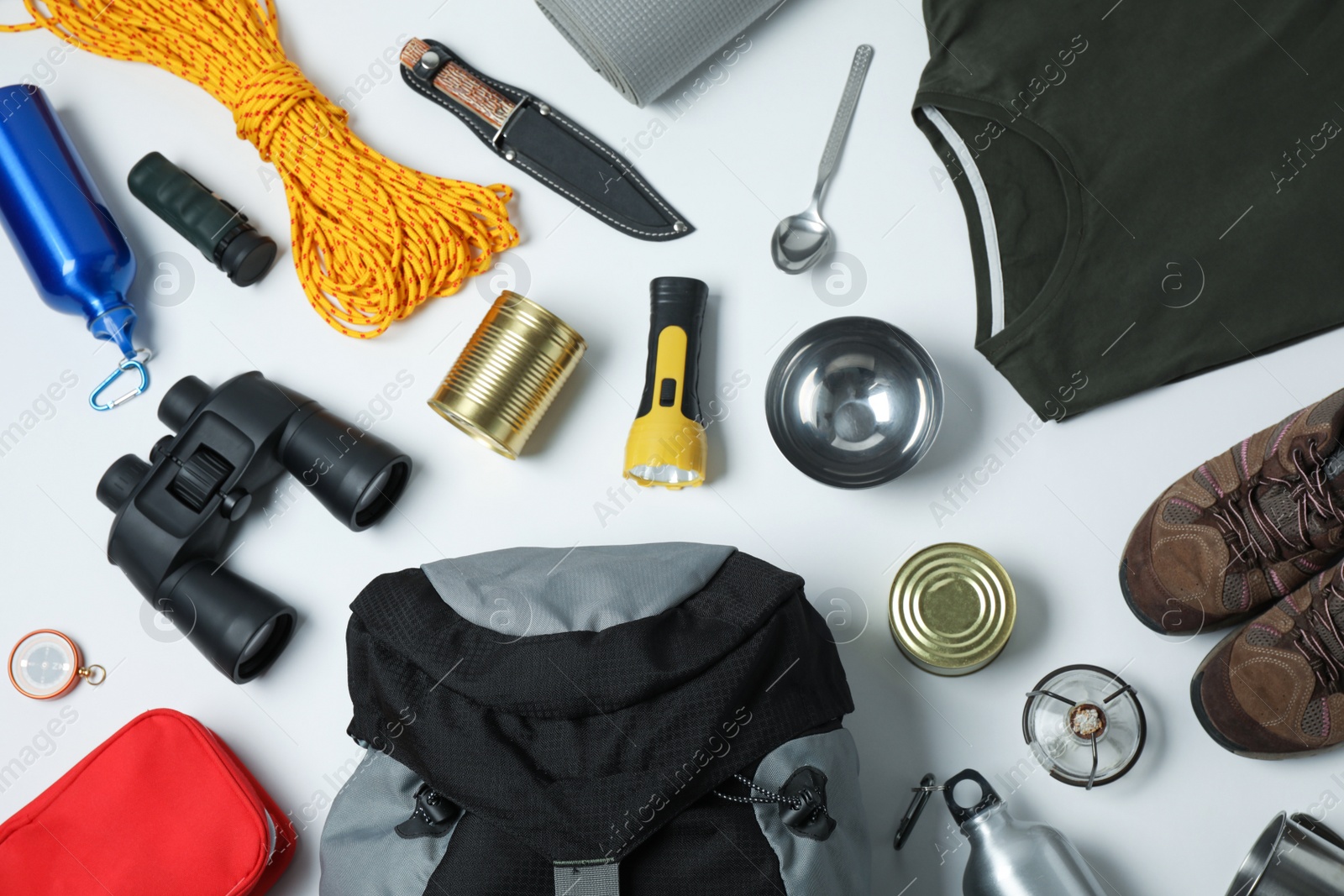 Photo of Flat lay composition with different camping equipment on white background