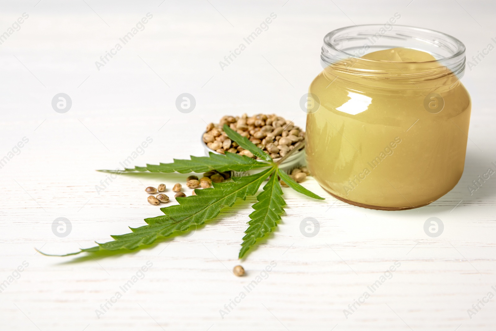 Photo of Composition with hemp lotion on white wooden background