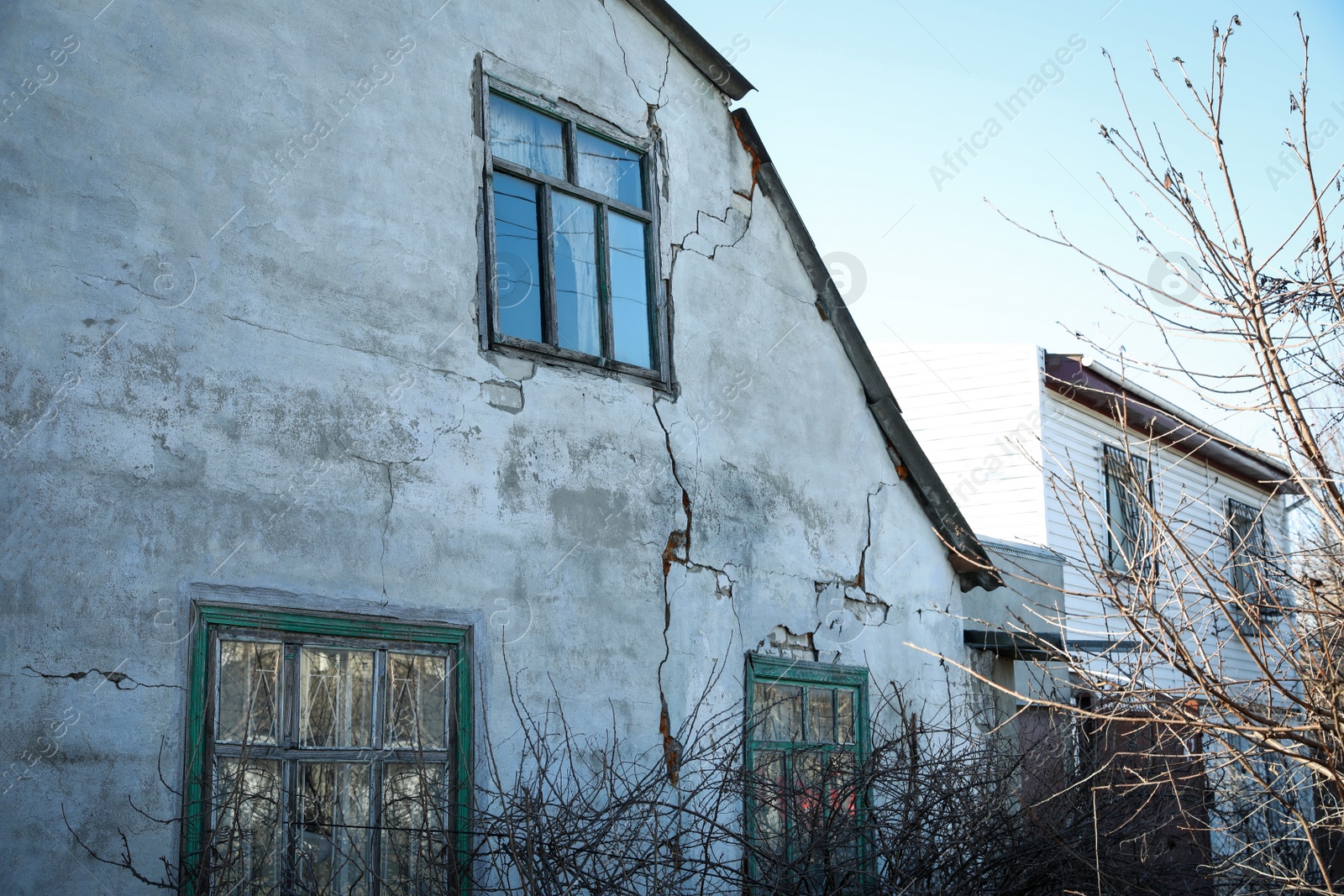 Photo of Exterior of damaged old house after strong earthquake