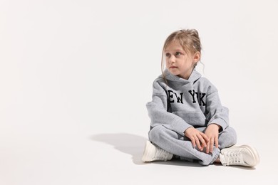 Photo of Fashion concept. Stylish girl posing on white background