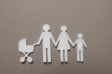 Photo of Paper family figures on light grey background, top view. Insurance concept