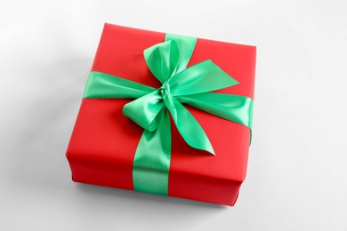 Photo of Beautifully wrapped gift box on white background