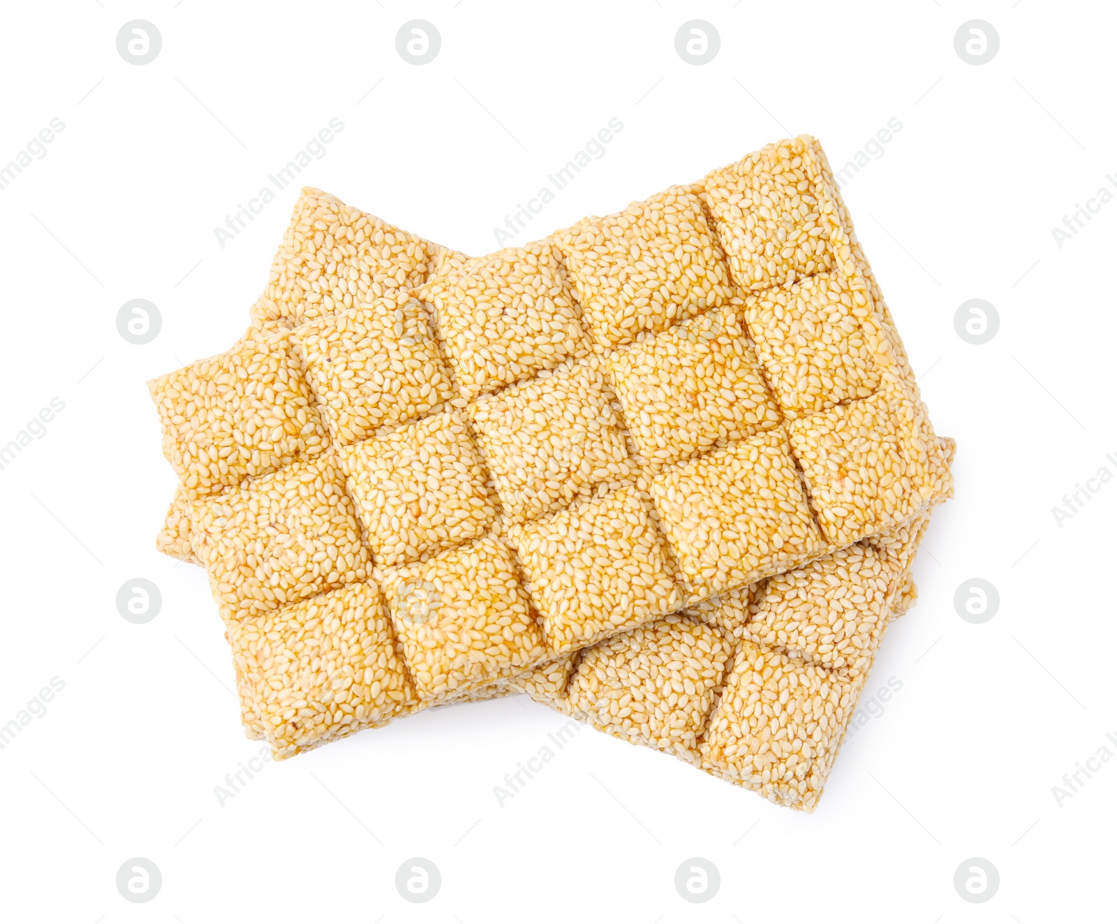 Photo of Delicious sesame kozinaki bars on white background, top view