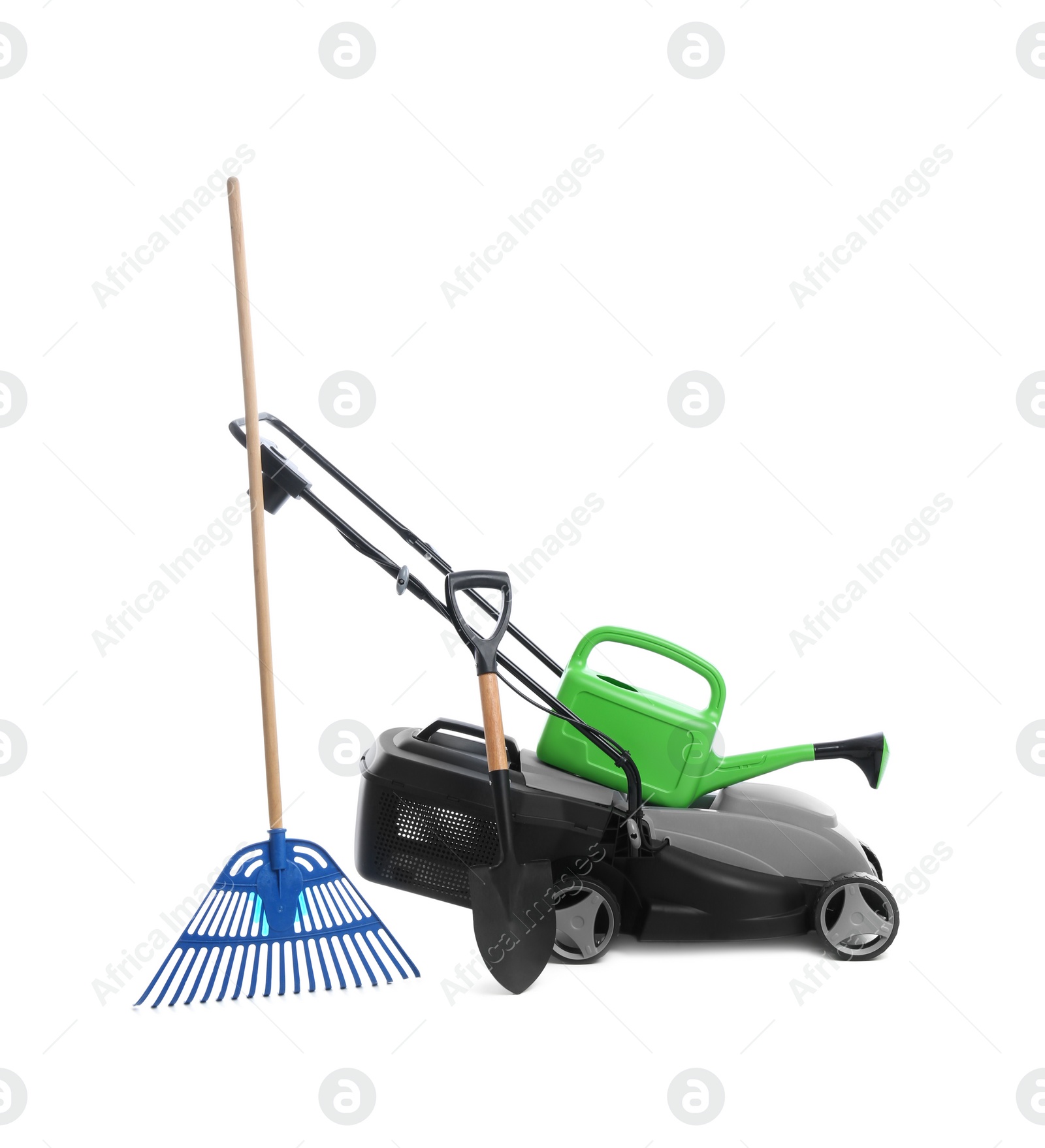 Photo of Modern electric grass cutter and gardening tools on white background