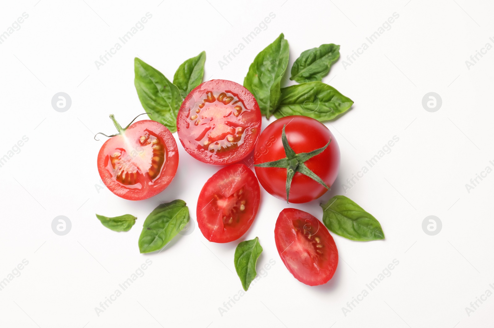 Photo of Fresh basil leaves and tomatoes on white background, flat lay