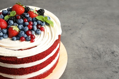 Photo of Delicious homemade red velvet cake and space for text on table