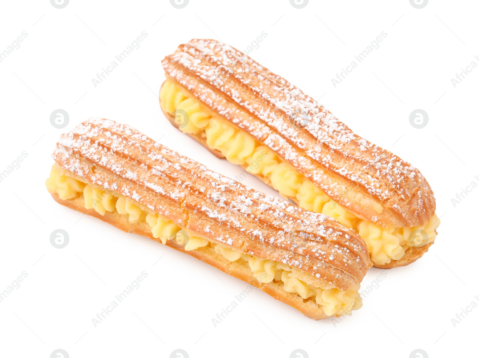 Photo of Delicious eclairs filled with cream isolated on white