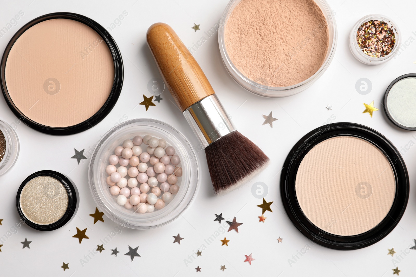 Photo of Flat lay composition with makeup products and Christmas decor on white background