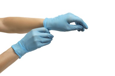 Doctor wearing light blue medical gloves on white background, closeup