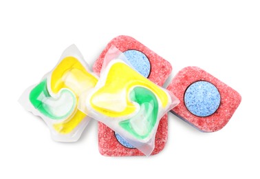 Photo of Dishwasher detergent pods and tablets on white background, top view