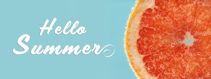 Hello Summer. Slice of grapefruit in sparkling water on light blue background, banner design.