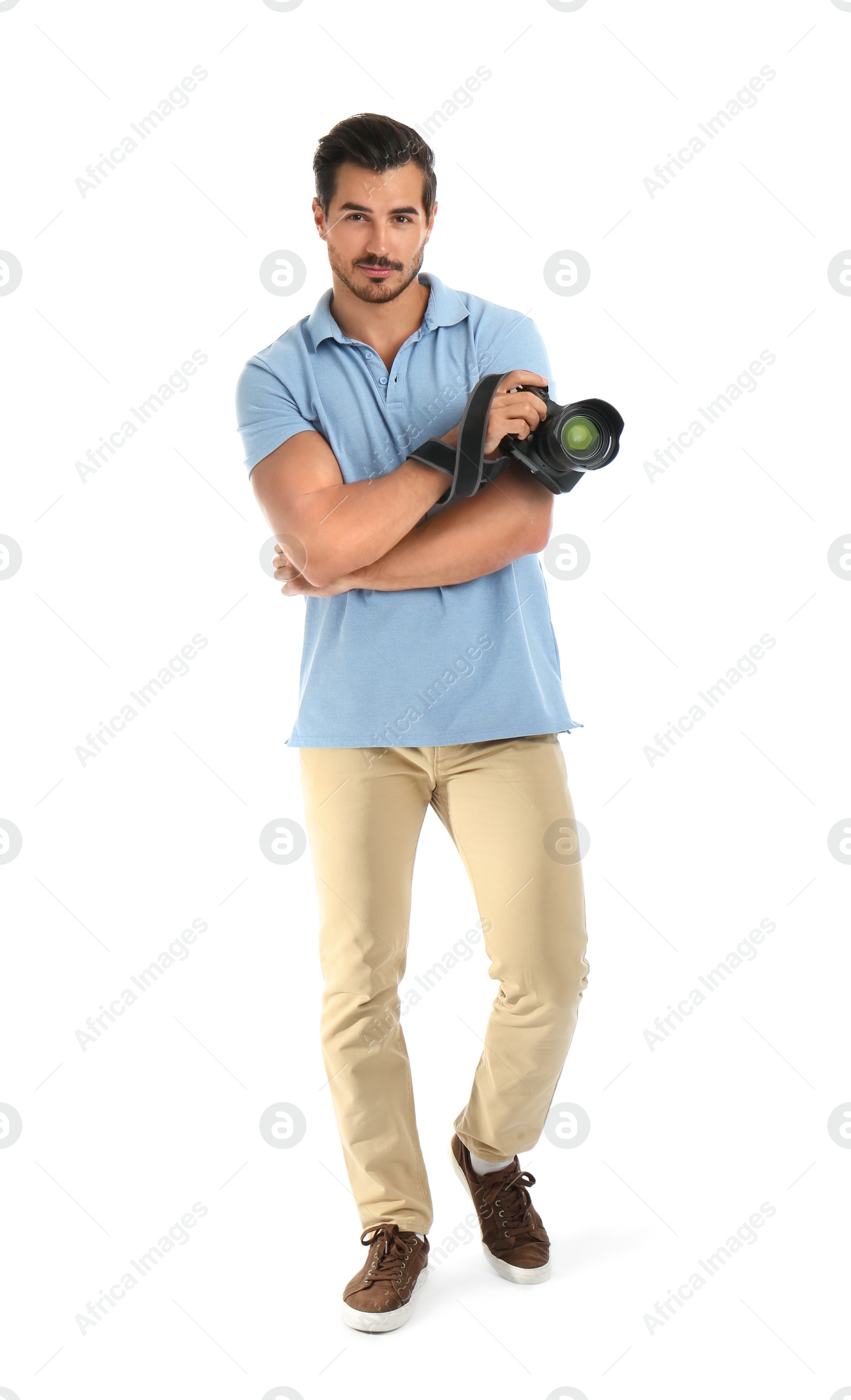 Photo of Young photographer with professional camera on white background