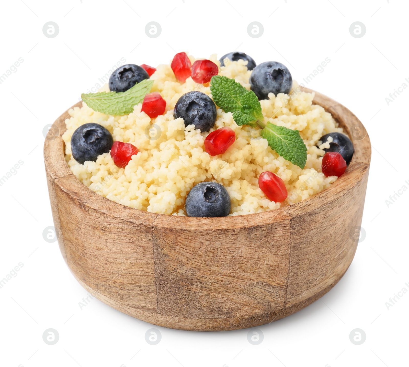 Photo of Bowl of tasty couscous with blueberries, pomegranate and mint isolated on white