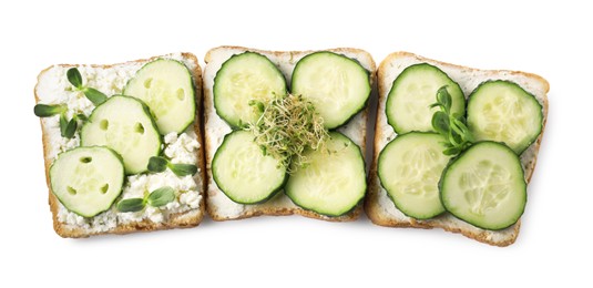 Tasty toasts with cucumber, cream cheese and microgreens isolated on white, top view