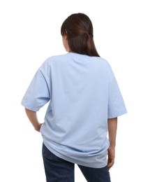 Woman in stylish light blue t-shirt on white background, back view