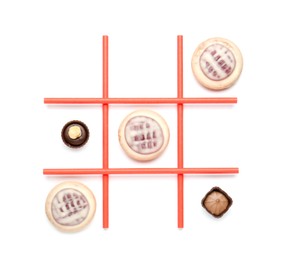 Tic tac toe game made with cookies and sweets isolated on white, top view