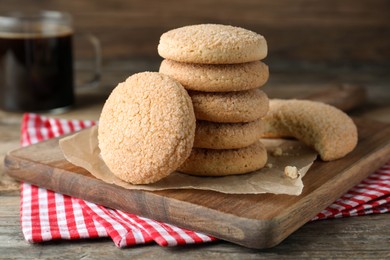 Photo of Delicious sugar cookies on wooden table, closeup