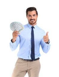 Handsome businessman with dollars on white background