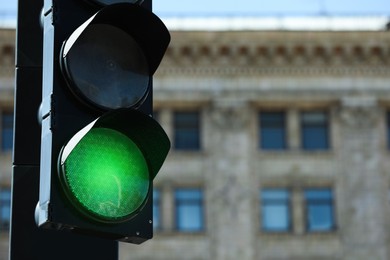 Photo of View of traffic light in city on sunny day, closeup. Space for text