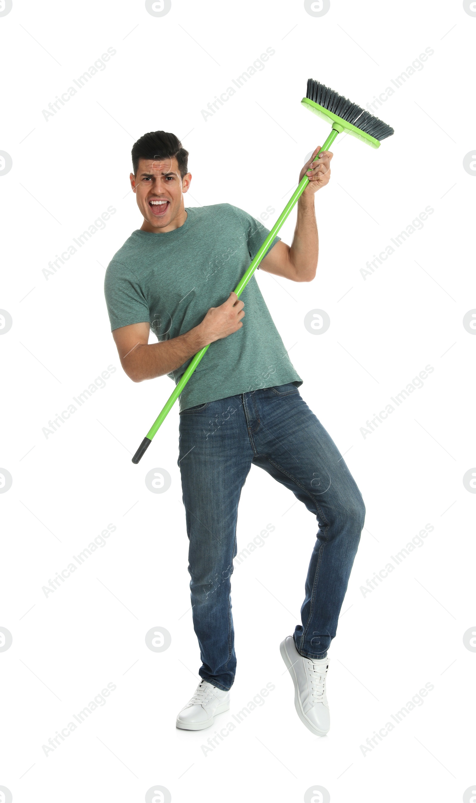 Photo of Man with green broom on white background