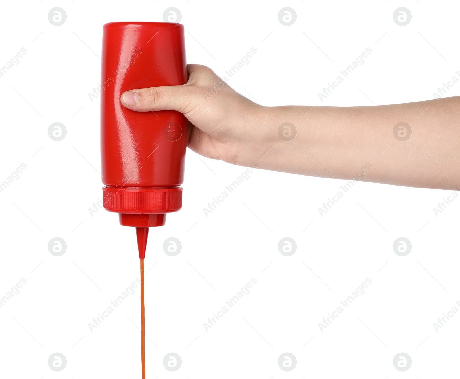 Photo of Woman pouring tasty ketchup from bottle on white background, closeup