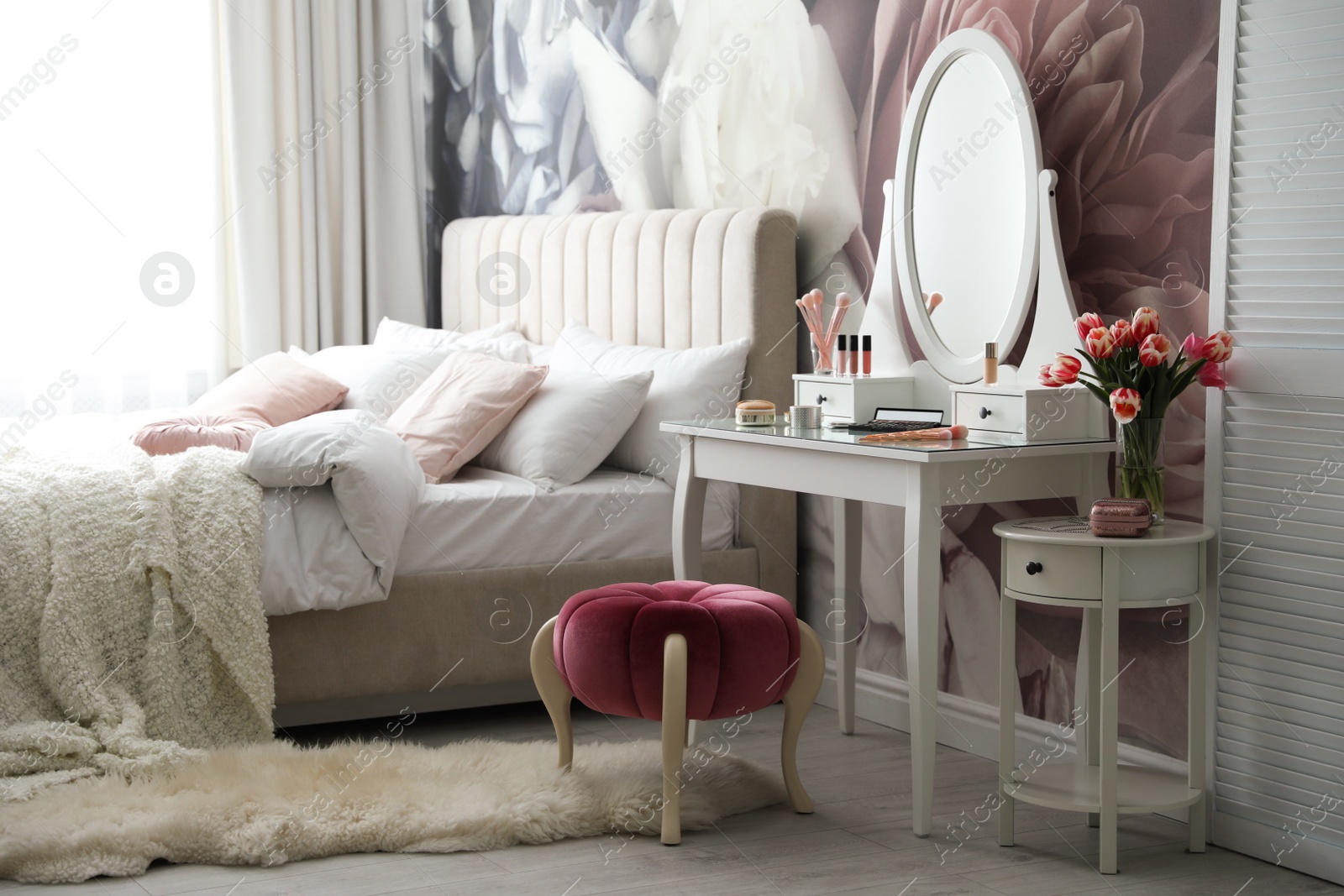 Photo of Stylish bedroom interior with elegant dressing table and floral wallpaper