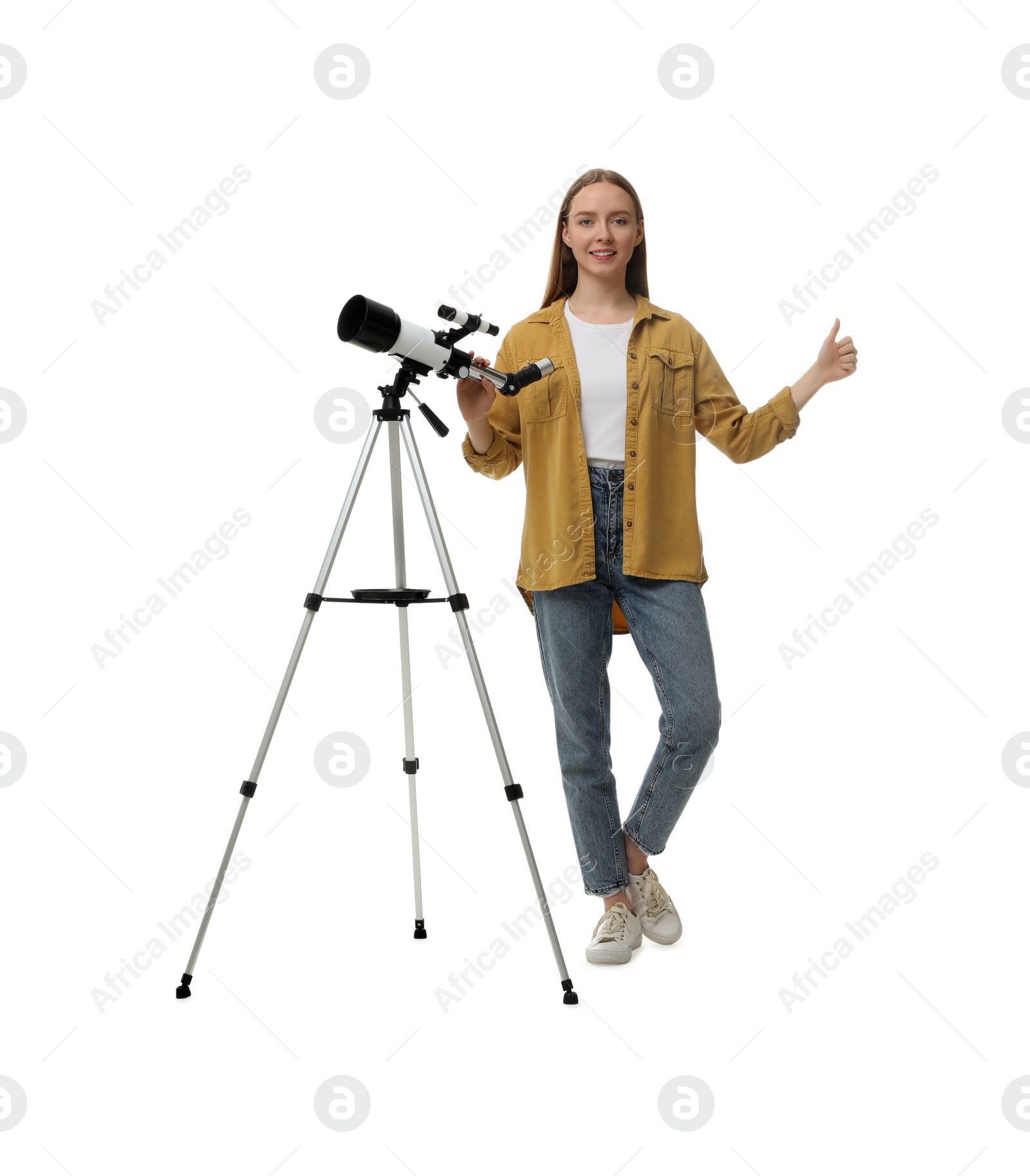 Photo of Young astronomer with telescope showing thumbs up on white background